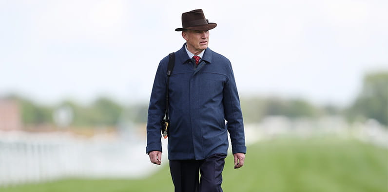 Roaring Lion trainer walking on the racetrack